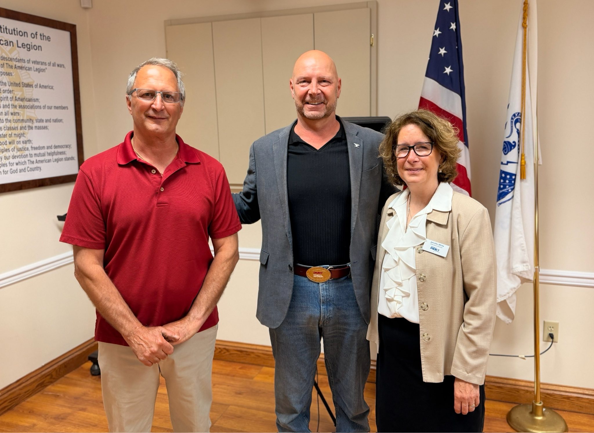 Senator Mastriano standing in between two people inside an American Legion