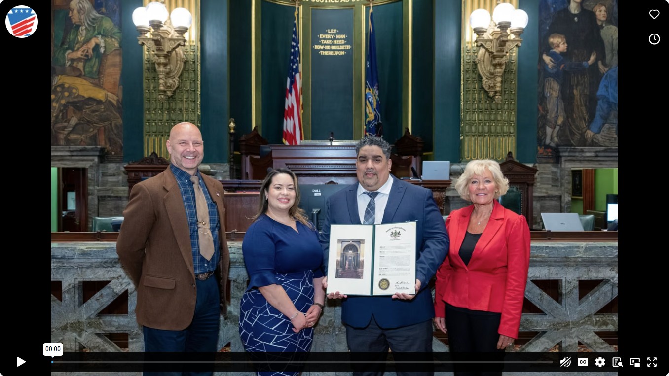 Senator Mastriano standing inside the Senate chambers next to Alcides Perez, Jr’s wife, Specialist Perez and Senator Boscola