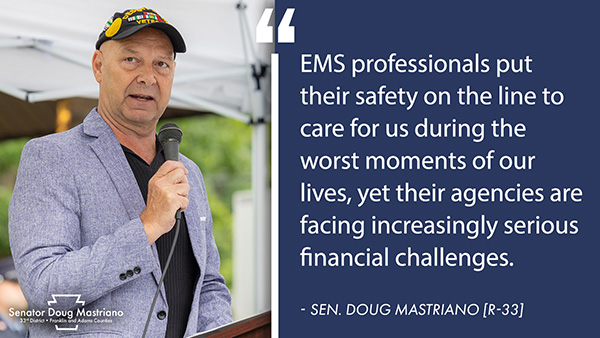 Senator Doug Mastriano speaks into a microphone, appearing alongside an overlay graphic detailing financial challenges faced by EMS professionals.